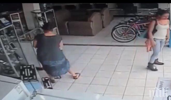 Уникално! Жена открадна телевизор, като го скри под полата си! (видео)