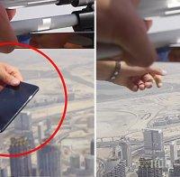 КРЪГЪЛ ИДИОТ! Блогър провери IPhone 7 Plus, като го хвърли от най-високата сграда в света (ВИДЕО)