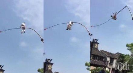 луд късмет китайски акробат оцеля падна осем метра височина бетон