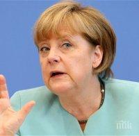Освиркаха Меркел по време на митинг