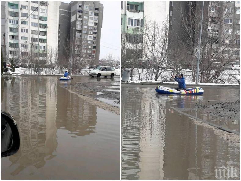 СОФИЯ ПРЕЗ ЗИМАТА: Ентусиаст преплува с лодка столична улица 