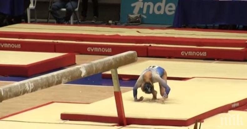 Екшън! Абсолютна световна шампионка по гимнастика се приземи на глава след изпълнение на греда (ВИДЕО)