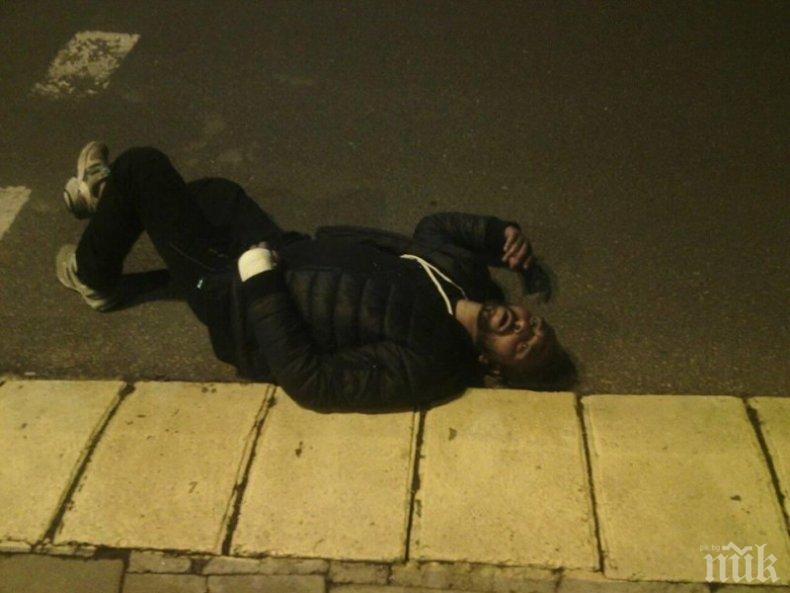 ВНИМАВАЙТЕ! Циганин лежи в центъра на Пловдив! Симулира побой
