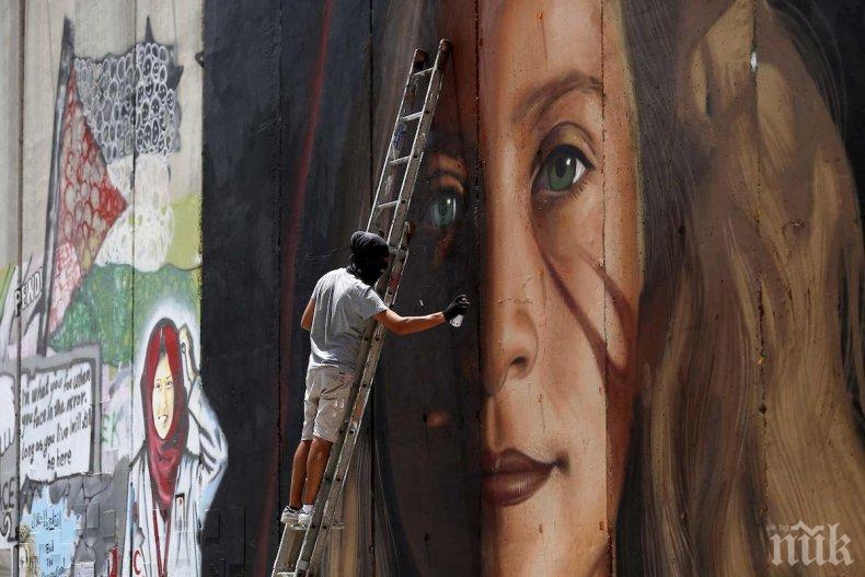 Израел ще депортира двама италиански артисти заради графити върху разделителна стена на Западния бряг