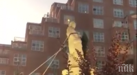 протестиращи събориха статуя колумб балтимор