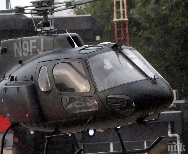 ПОД ПРОЛИВЕН ДЪЖД: Том Круз приземи майсторски вертолет в Лондон