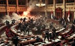 ШОКИРАЩО! Размирици, бой и димки в парламента на Сърбия - депутатка се бори за живота си (ВИДЕО)